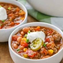 bowls of Taco Soup Recipe with sour cream and jalapeño on top