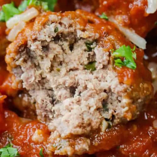 close up of Crockpot Meatballs with a bite taken out of one.