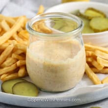 jar of Big Mac Sauce with fries and pickles.