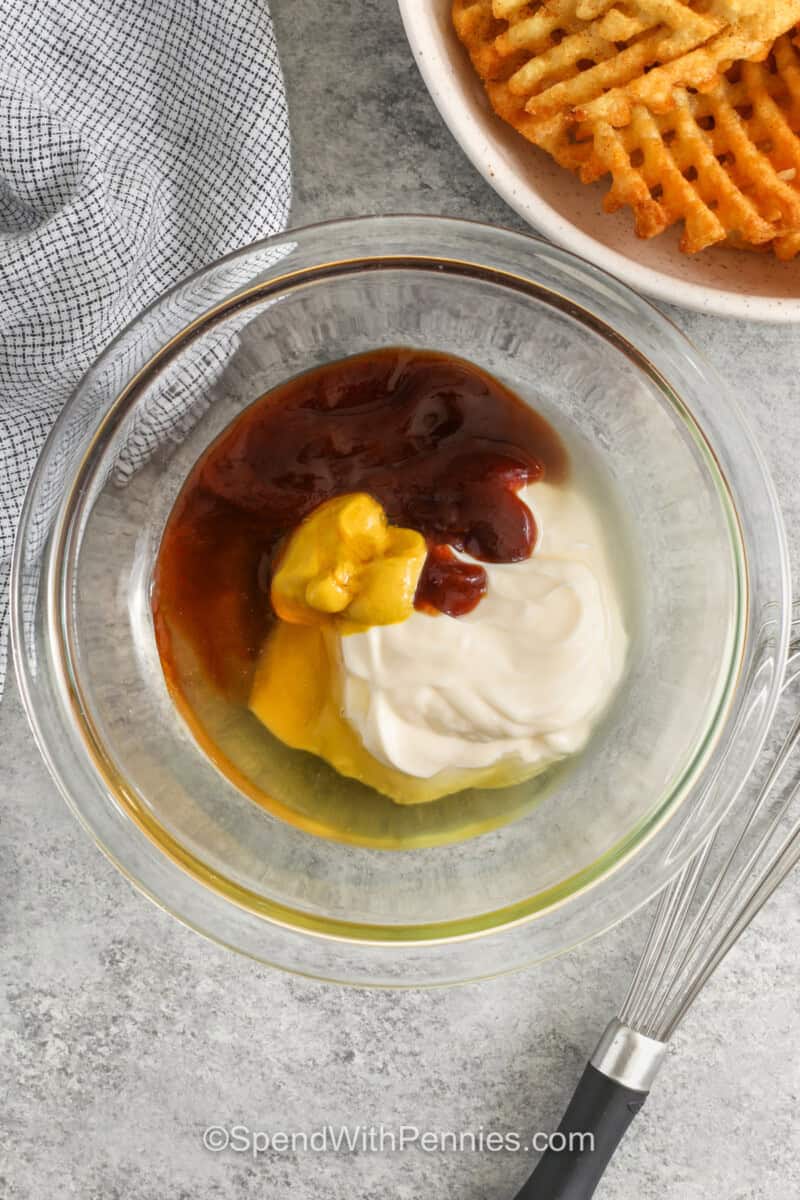 adding ingredients to bowl to make Chick-Fil-A Sauce.