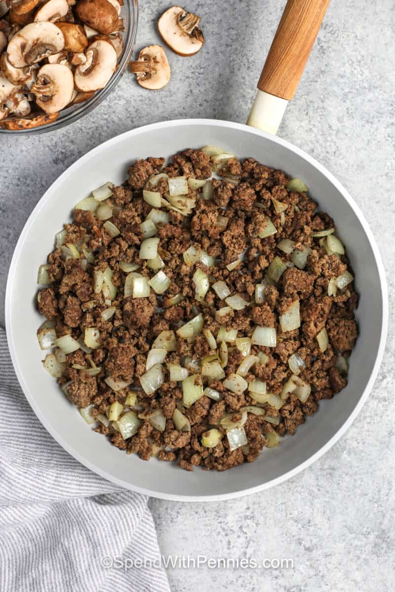 cooking beef with onion to make Ground Beef Stroganoff.