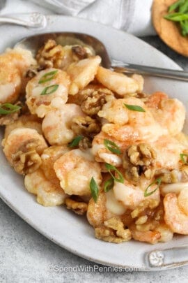 Honey Walnut Shrimp on a plate with a spoon.