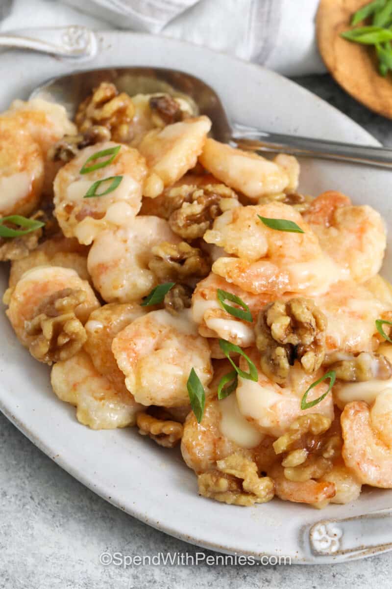 Honey Walnut Shrimp on a plate with a spoon.