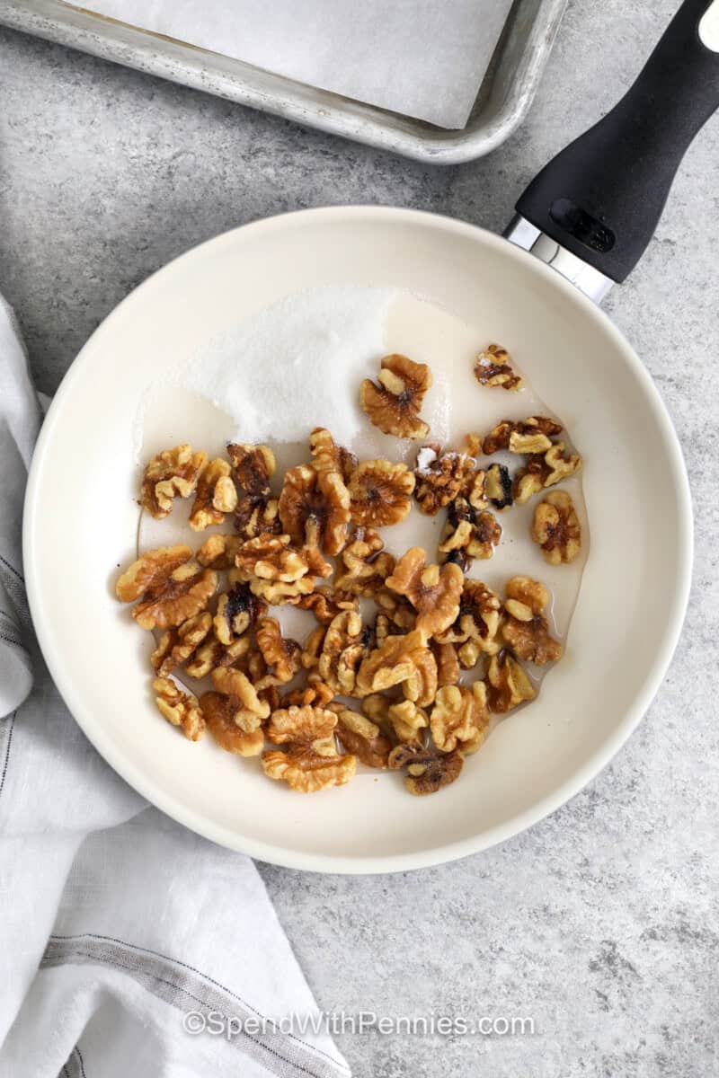 adding ingredients to walnuts to make Honey Walnut Shrimp.