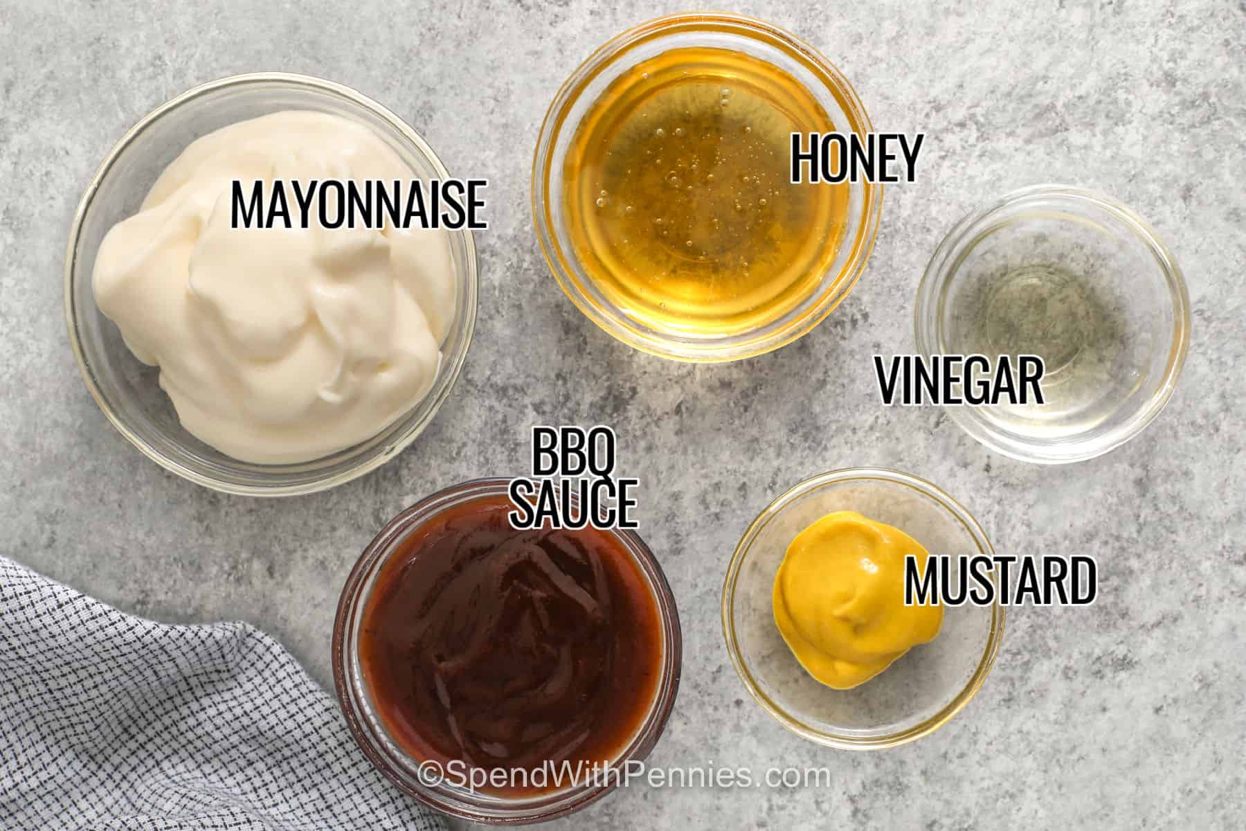 mayonnaise , honey , bbq sauce , mustard , vinegar with labels to make Chick-Fil-A Sauce.