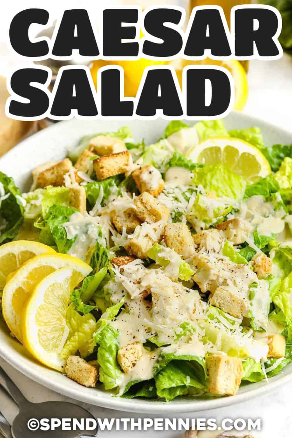 Classic Caesar salad is easy to make at home with crisp romaine, Parmesan cheese, crunchy croutons, and a creamy homemade dressing. The blender dressing gets bold, savory flavor from anchovies, fresh lemon, garlic, Dijon, and Worcestershire sauce. Everything comes together in about 25 minutes, making it an easy choice for weeknight dinners or entertaining. Save this classic salad for an easy restaurant-style side. #spendwithpennies fresh Caesar Salad with a title.