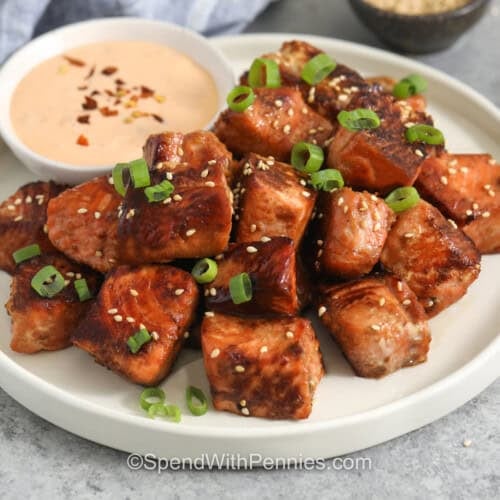 Salmon Bites on a plate with dipping sauce.